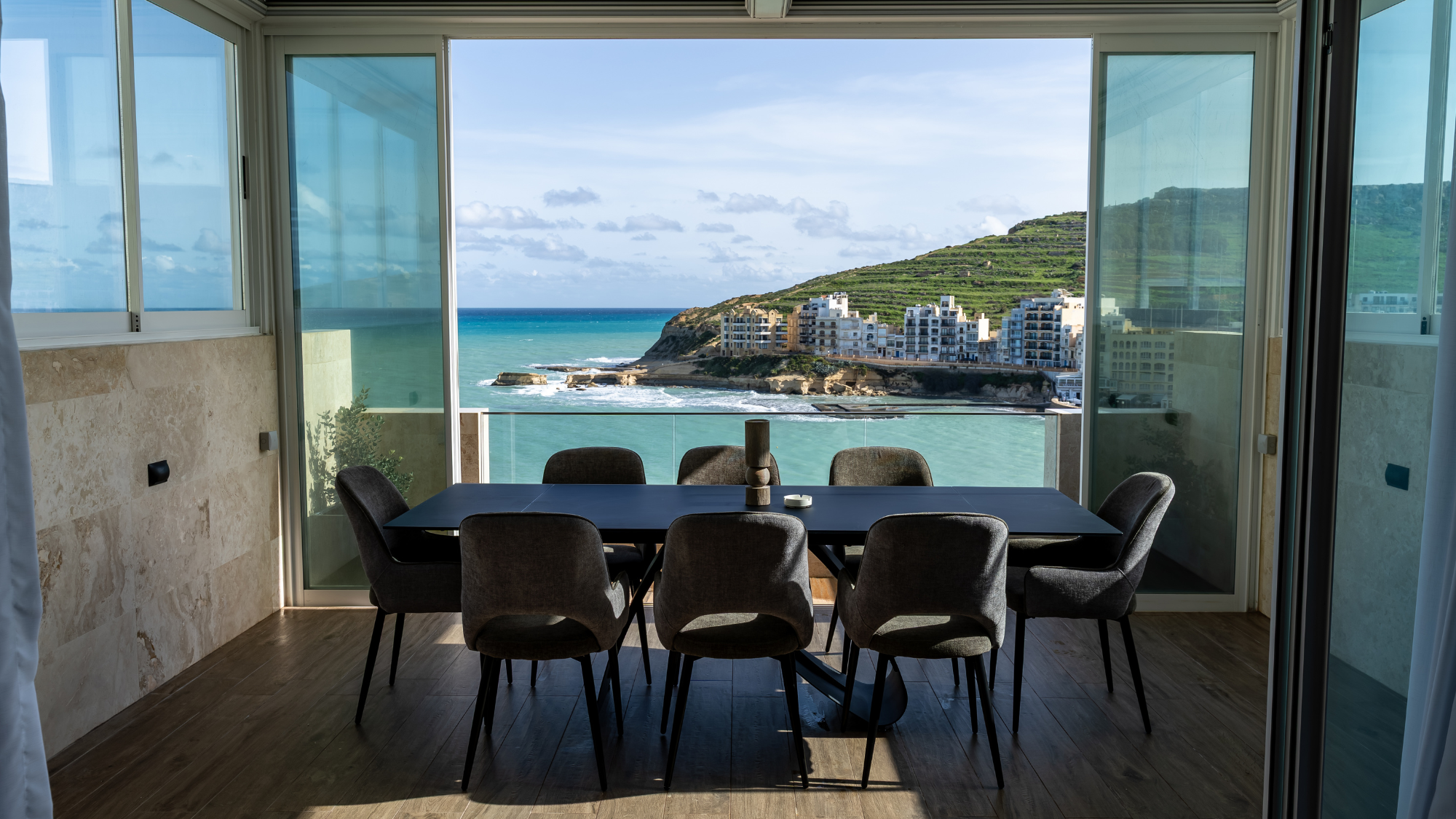Dining area overlooking the sea from Elzan’s Marsalforn apartments